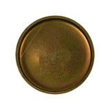 Flat top-down view of concave face showing recessed seating rim around full circumference; warm golden-brown oxidised zinc-chromate surface with moderate deterioration; no additional markings visible