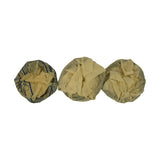 Three cylinder ring sets shown from reverse side, still in paper wrapping. Left wrapper printed with installation instructions for oil control ring segments. Ring profiles faintly visible through aged, dust-marked paper.