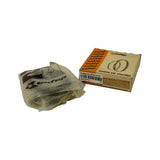 Three-quarter view showing box alongside the opened inner Cofap branded plastic bag containing the ring sets. Box spine confirms DC.6763 STD and fitment text. Bag is intact but has been opened; contents spill out.
