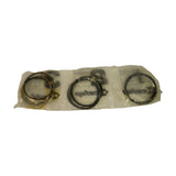Reverse side of the inner bag, showing the three grouped ring packets from the underside. The leftmost packet (group 1) shows an expander/oil control ring with a gold or brass-coloured element visible through the plastic. Groups 2 and 3 appear to contain dark-finished compression and oil rings.
