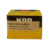 Rear/side panel of NPR box showing secondary label printed 'RSH-C20A StdNPR / Ringset Honda C20A / 82.00mm 1.2/1.2/2.8mm'. Handwritten pencil annotations 'V6' and 'C20A 5 cyl' visible on label.