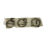Reverse angle of the three per-cylinder packs showing ring profiles through translucent film — two compression rings and a multi-piece oil control ring assembly visible per pack. All packs appear undisturbed and correctly sealed.