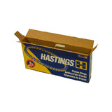 Three-quarter perspective of complete closed Hastings box open at top, showing full branded livery with Hastings logo, Precision International mascot roundel, 'Piston Rings' trilingual text, USA flag, and slightly crushed top corners.