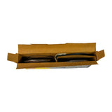 Top-down view of opened Hastings box showing ring set contents. Left side of the tray holds a stack of gold-toned serrated/wavy oil control expander rings. Right side holds a stack of flat dark compression and oil rail rings, separated by a cardboard divider insert. Box interior is plain kraft cardboard.