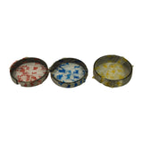 Three ring packs separated and laid flat side by side: red-tissue '1st.' pack (left), blue-tissue '2nd.' pack (center), yellow-tissue 'Oil 1' pack (right). Ring diameters and metallic finish clearly visible through plastic wrap.