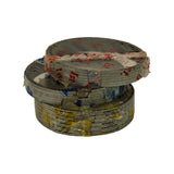 Two ring stacks stacked on top of each other: 1st compression ring stack (red tissue, top) and oil control ring stack (yellow tissue, bottom, thicker stack). Side profile shows individual ring gaps clearly.