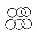 Second top-down view of six rings in two rows, slightly different angle; confirms matching ring diameter across all six, consistent with a standard-bore 6-cylinder set.