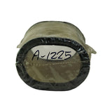 End view of closed cap, silver foil/metal seal with 'A-1225' written in blue marker, black rubber gasket ring around perimeter