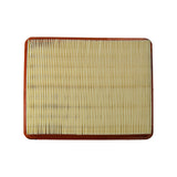 Top-down view of clean inlet face of the filter element, pleats running across the long axis, orange frame visible on all four sides