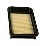 Inlet-face top-down view showing recessed inlet well around raised pleated element, partial yellow adhesive label visible at the far left edge