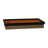 Low-angle profile view showing overall element thickness and black gasket lip standing proud of cream end cap