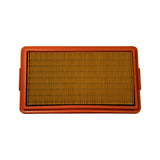 Top face of orange polyurethane-framed panel air filter, yellow pleated paper element fully visible, side locating tabs at 3 and 9 o'clock positions