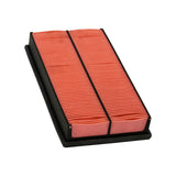 Three-quarter view emphasising pleat count and media condition — orange/red paper appears clean, unused, pleats uniform with no collapse or contamination