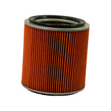 Three-quarter view of extracted cylindrical air filter element. Orange pleated paper element with grey/silver metal end caps and black rubber sealing gaskets top and bottom. Inner perforated metal mesh core visible through open top end.