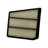 Opposite long-side angled view of the filter element showing three columns of pleats from the side. Black plastic rim and internal dividers visible. Filter appears clean and unused with no dust loading.