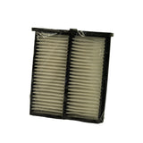 Front face of filter unit slightly angled, showing both filter panels side by side within the black plastic outer frame, poly bag still sealed.