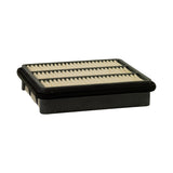 Low-angle view from inlet face (underside), showing shallow black plastic tray/base and the underside of the pleated element with inner plastic support ribs visible.