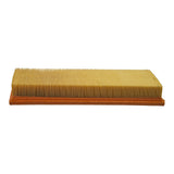 Elevated angle showing full pleated media surface on inlet face, clean unused media, orange urethane gasket perimeter visible.