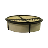 Three-quarter isometric view showing filter profile — round disc form, pleated paper element exposed on top face, smooth felt/paper outer wrap on sidewall, rubber base seal ring on bottom, black plastic grid on top.