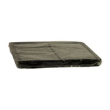 Side-on profile view of filter showing flat rectangular form factor and overall thickness; plastic wrapping clearly visible around perimeter