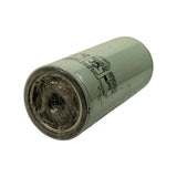 Base/thread-end of filter laid on side. Threaded female port covered with original plastic protective film, confirming new unused condition. Installation instructions panel partially visible on body.