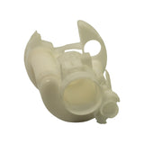 Bottom-up view; two outlet ports visible — one large circular bore and one smaller lateral port; bayonet locking fins around the equator; inner element slightly discoloured/cream from age