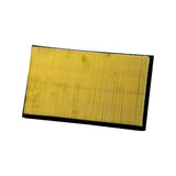 Underside of filter showing exposed pleated yellow paper element and black perimeter seal, slight surface dust/age marks visible on pleats.