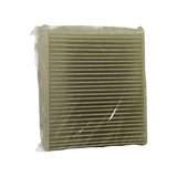 End-on view of pleated white paper filter element through clear plastic wrap, showing horizontal pleat construction and clean unused condition