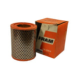 Filter removed from box and placed alongside, showing cylindrical form with orange rubber end caps and perforated steel outer casing. Box side visible with barcode and AIR FILTER / LUFTFILTER / FILTRE A AIR text.