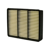 Three-quarter view from below-right showing depth of the black plastic frame and the outlet face of the pleated element. No stamps, labels, or part numbers visible on frame sides.