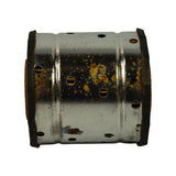 Side/profile close-up of canister showing heavy surface oxidation and rust spotting on the perforated steel body; black fibre end caps visible top and bottom.