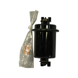 Filter standing upright alongside open plastic bag containing four copper crush washers. Upper fitting shows brass banjo bolt seat and small bracket tab. Body is gloss black painted steel. Minor surface dust.