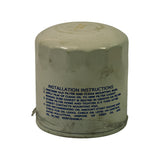 Reverse side of filter canister showing blue printed installation instructions in English over the white body. Partial clear plastic shrink-wrap visible around base.