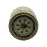 Base plate of filter (threaded end) showing central threaded inlet hole and 8 inlet ports arranged in a circular pattern around the centre. Grey painted plate with accumulated dust and grime.