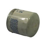 Three-quarter angle showing filter on its side. Both the installation instructions panel and the date code on the dome are partially visible. Filter shows aged white finish with general surface dust.