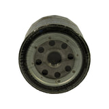 Base plate viewed from below showing threaded centre inlet port, eight oil inlet holes arranged in two rings, and crimped seam attaching base plate to canister body. Rubber gasket visible around circumference. Some minor discolouration on base plate consistent with age.