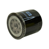 Three-quarter elevated angle showing base plate from slightly above, confirming inlet hole pattern and centre threaded port. Rubber gasket appears intact and undamaged.