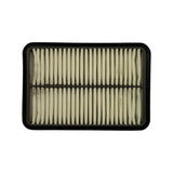 Filter element partially visible or removed from packaging — flat panel configuration, pleated paper/synthetic media, rubber or foam perimeter seal.