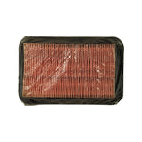 Reverse side of filter showing exposed pleated paper element edge-on across width; black rubber surround visible around perimeter; clear plastic wrap intact
