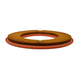 Filter element, low side profile showing the shallow, disc-like depth of the element. Orange rubber surround on top face prominent; underside face sits flush.