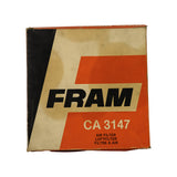 Front of original Fram carton, orange and cream livery, 'FRAM CA 3147' part number prominent, labelled AIR FILTER / LUFTFILTER / FILTRE A AIR. Box edges scuffed and discoloured from age.