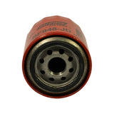 Base view of filter showing central 1 inch threaded mounting hole, eight surrounding inlet ports, and integral rubber gasket; some red paint flecks on the base plate