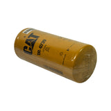 Filter laid on its side with shrinkwrap gathered and twist-sealed at one end, full cylindrical body visible with CAT logo and 1R-0739 label upright on the left