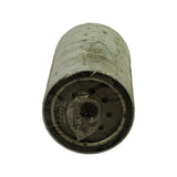 Base end of filter showing the steel mounting plate with central threaded port, sealing gasket and ring of fuel inlet holes, still wrapped in plastic