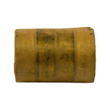Cam bearing wrapped in original waxed paper — side profile showing cylindrical form. Surface discolouration consistent with age of wrapping.