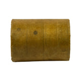 Side-on view of the VCI-paper-wrapped cam bearing bundle. Cylindrical form factor, two oil hole impressions visible through the paper wrap, golden-brown paper, no printing visible on this face.