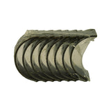 Bearing shells viewed from convex outer (steel back) side. Dark graphite-coloured ACL electroplate finish on steel backs visible. Poly wrap partially peeled.
