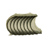 Inner bore face of bearing stack, overhead angle — polished silver bearing faces clearly visible; locating tangs visible at top and bottom edges.