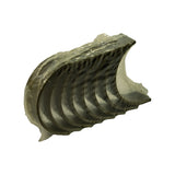 Three-quarter view of bearing stack in wrap, slightly elevated angle showing depth and curvature of shells; oil groove visible on inner face of upper shells.