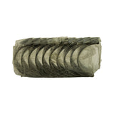 Opposite-face view of the wrapped bearing set showing the steel-backed outer surface of the shells. Semi-circular shells stacked, all still wrapped together in factory plastic.